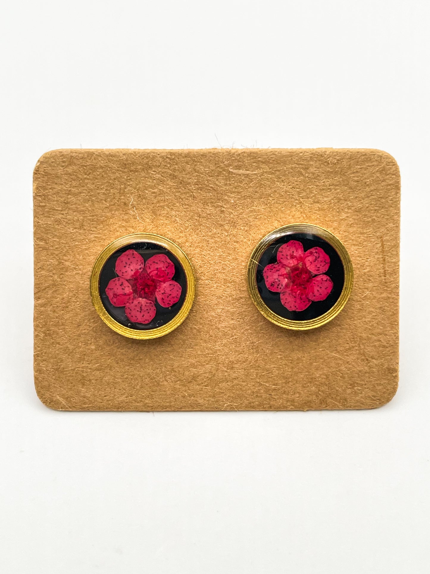 Stud earrings with red flowers in black lacquer