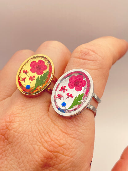 Cocktail ring with red flowers in oval shape