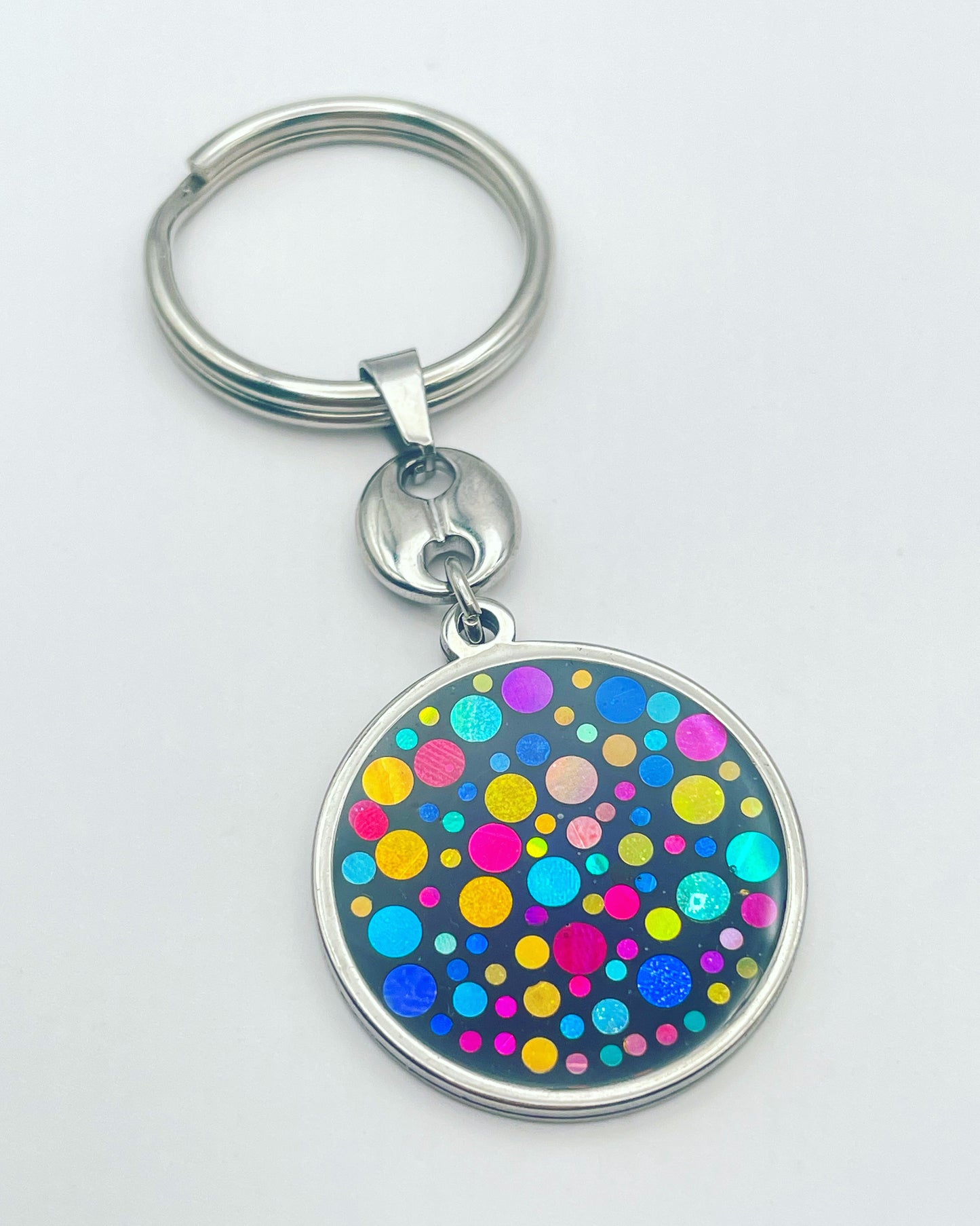 Disco keyring with colourful sparkles in circle shape