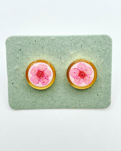 Stud earrings with pink flowers in white lacquer