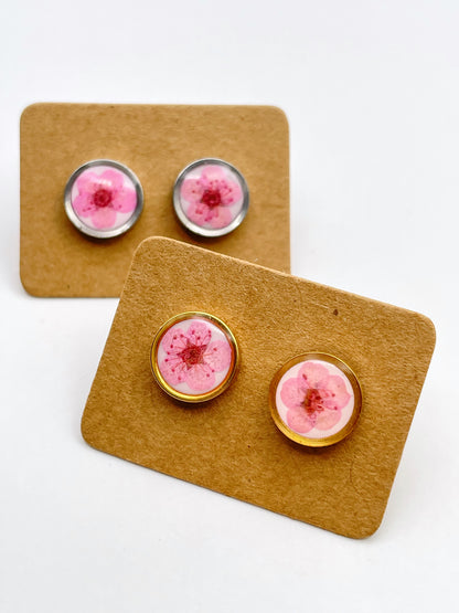 Stud earrings with pink flowers in white lacquer