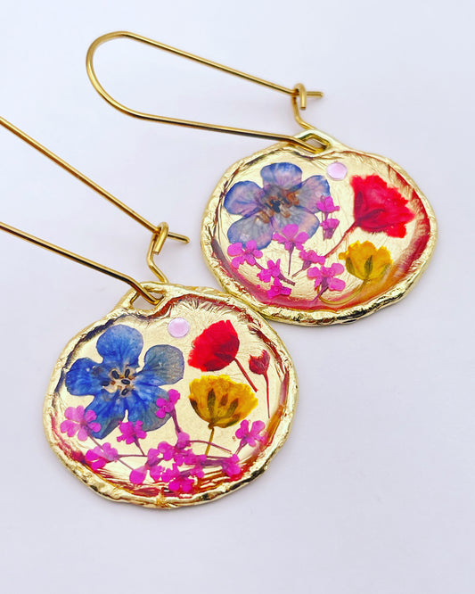 Gold dangle earrings with red and blue flowers