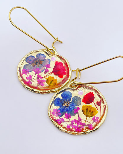 Gold dangle earrings with red and blue flowers