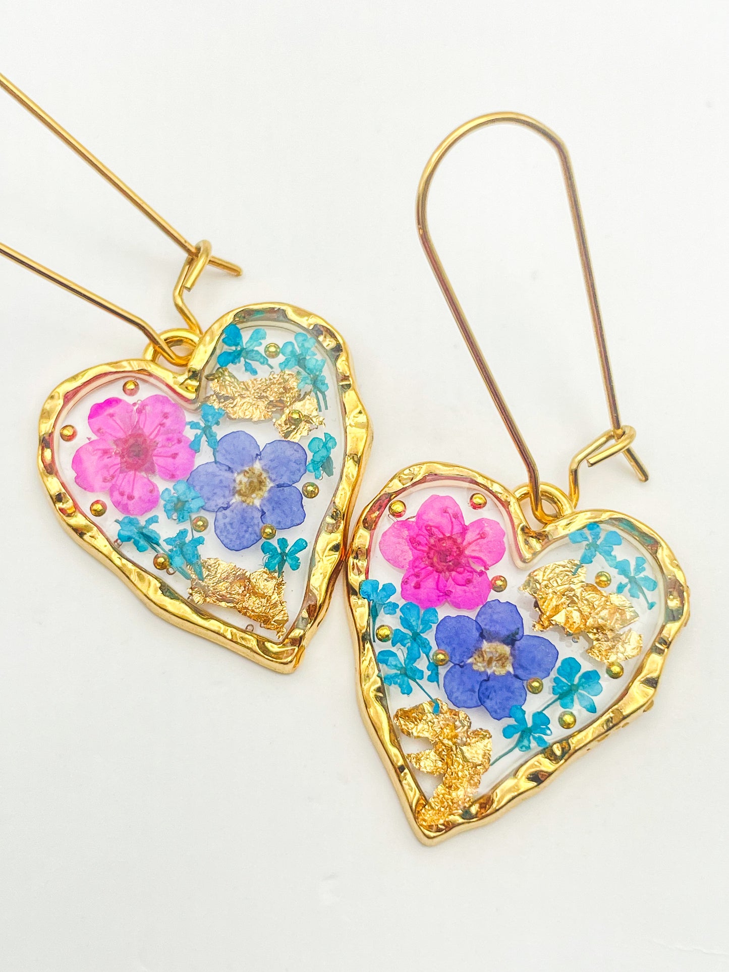 Heart dangle earrings with forget-me-not and pink flowers