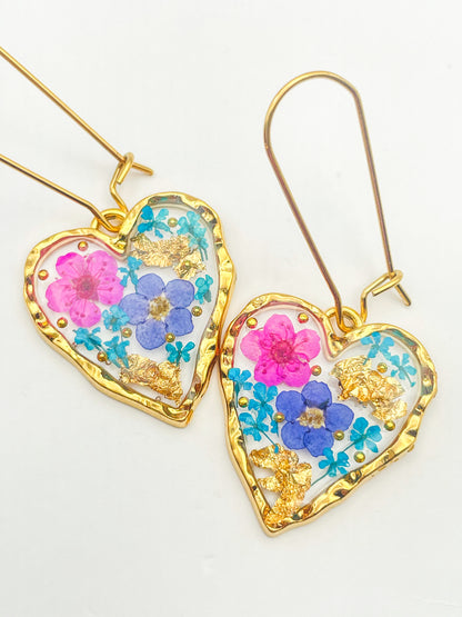 Heart dangle earrings with forget-me-not and pink flowers