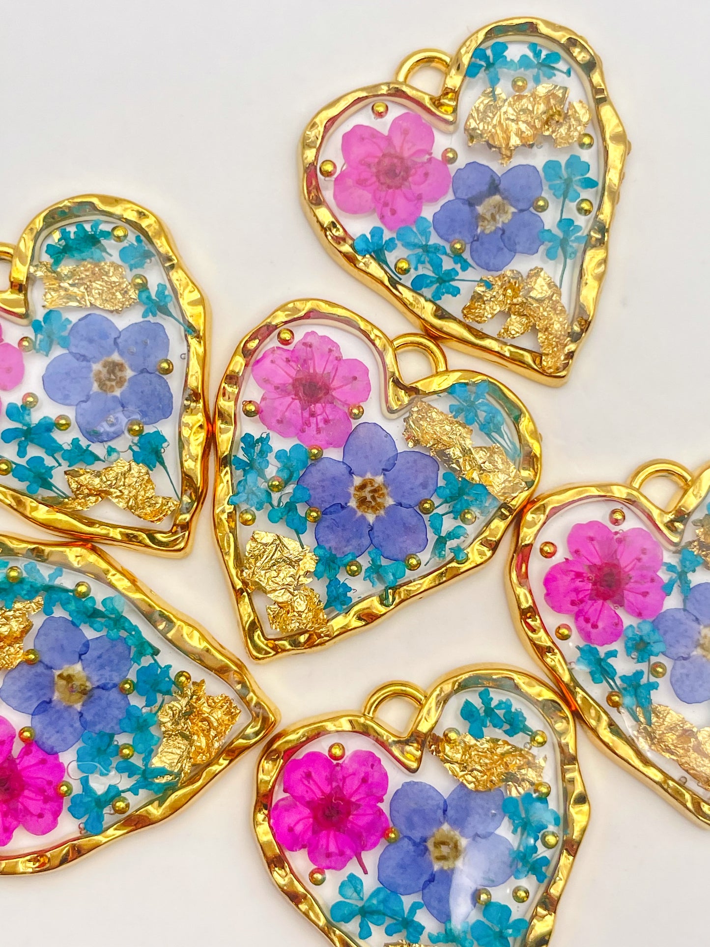 Heart necklace with forget-me-not and pink flowers