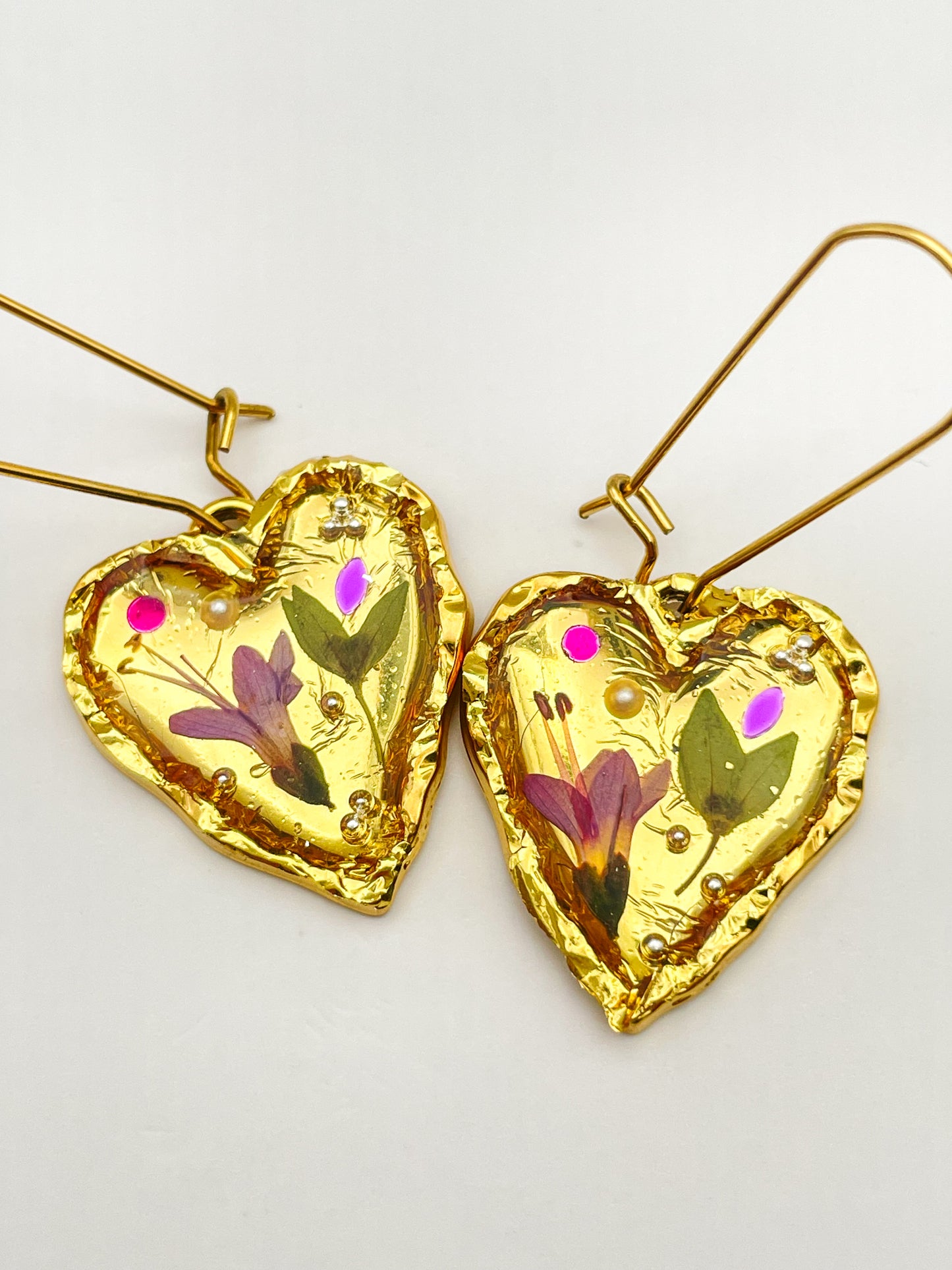 Gold heart earrings with pink flowers
