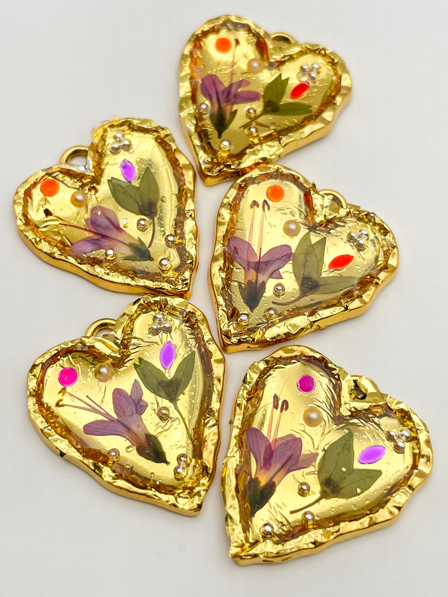 Gold heart earrings with pink flowers