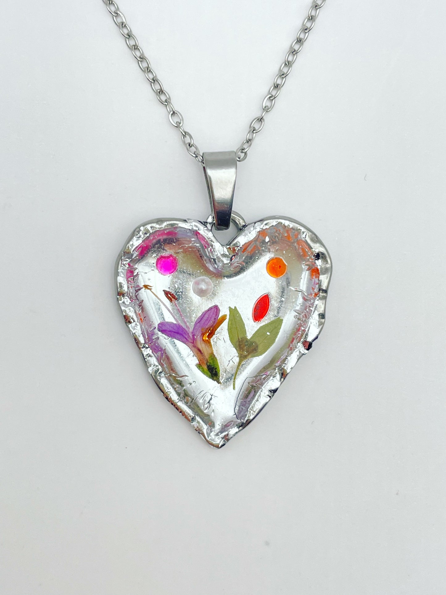 Silver heart necklace with pink flowers