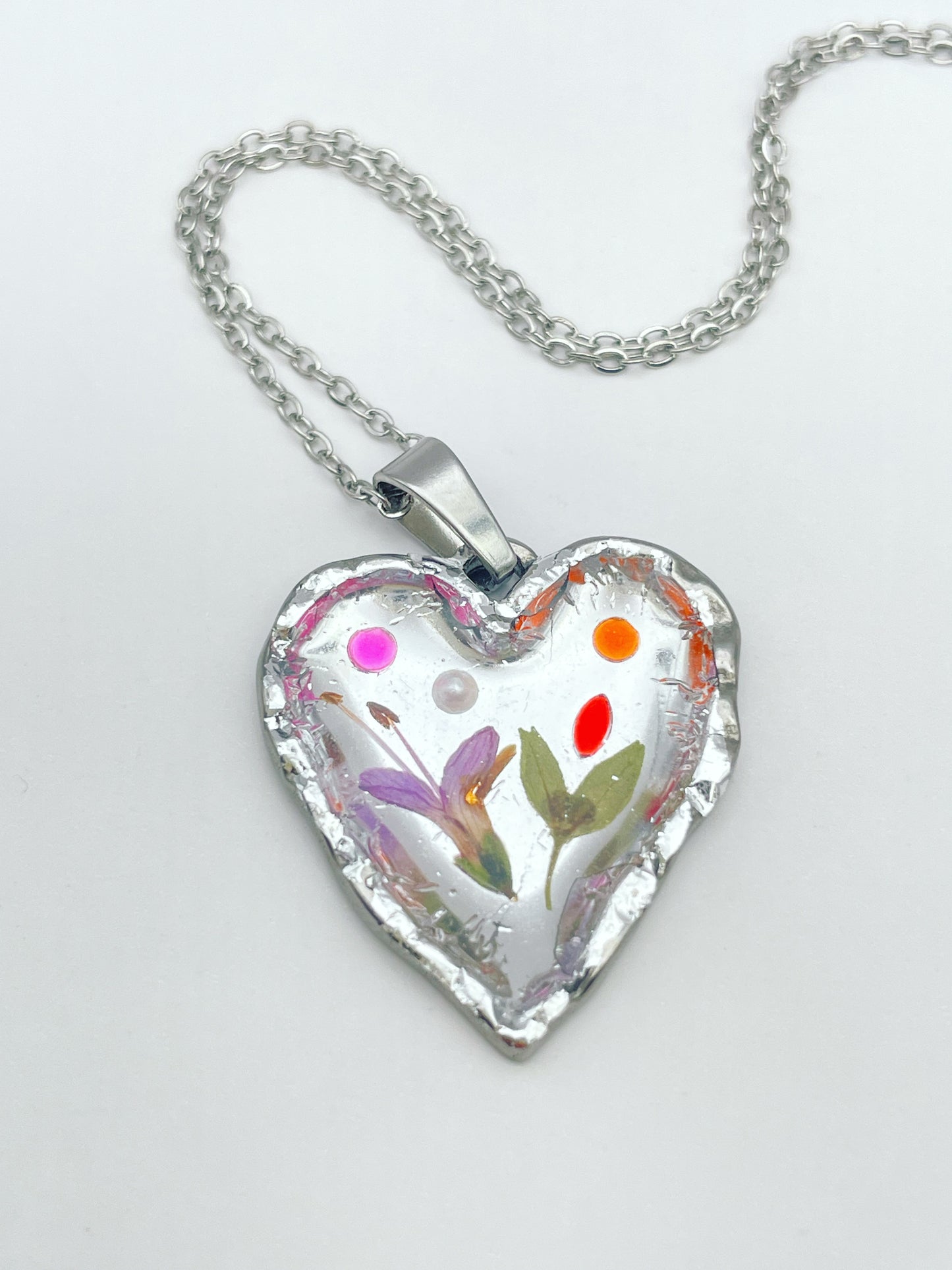 Silver heart necklace with pink flowers