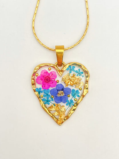 Heart necklace with forget-me-not and pink flowers