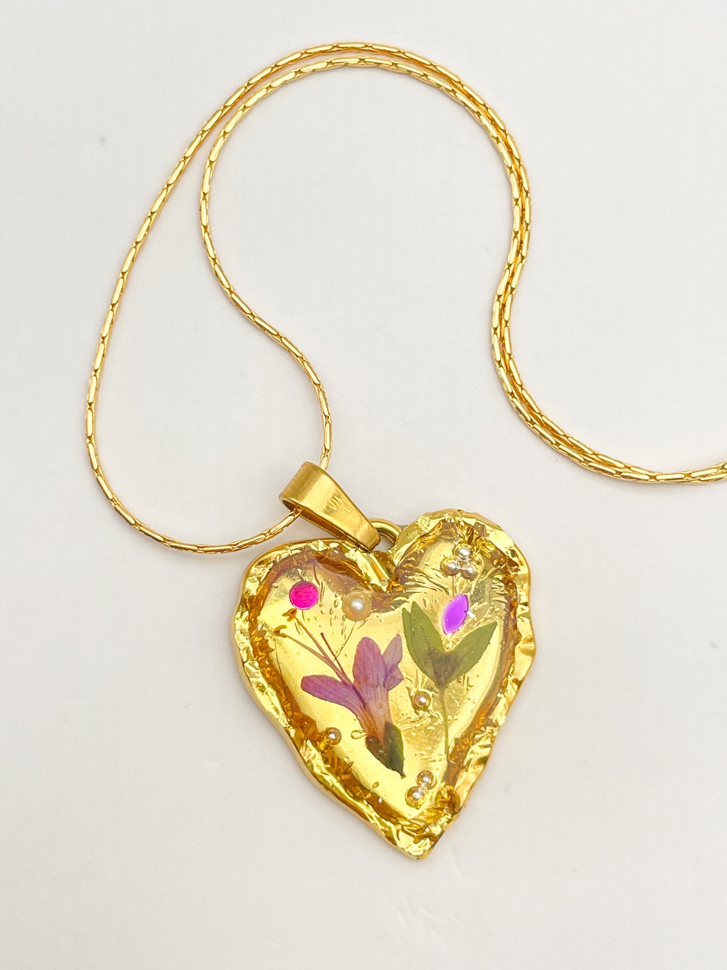 Gold heart necklace with pink flowers