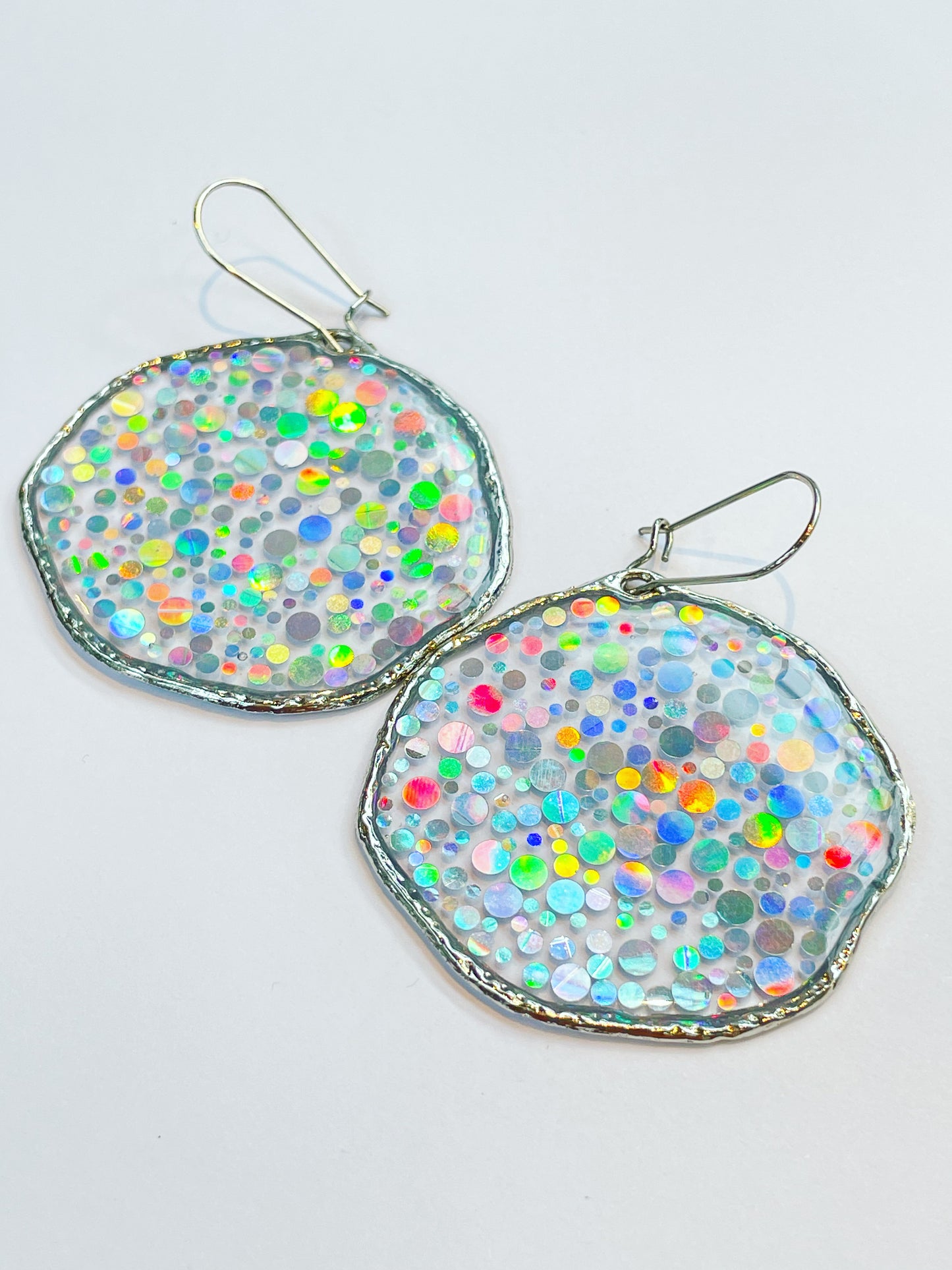 Large disco earrings with holographic silver sparkles