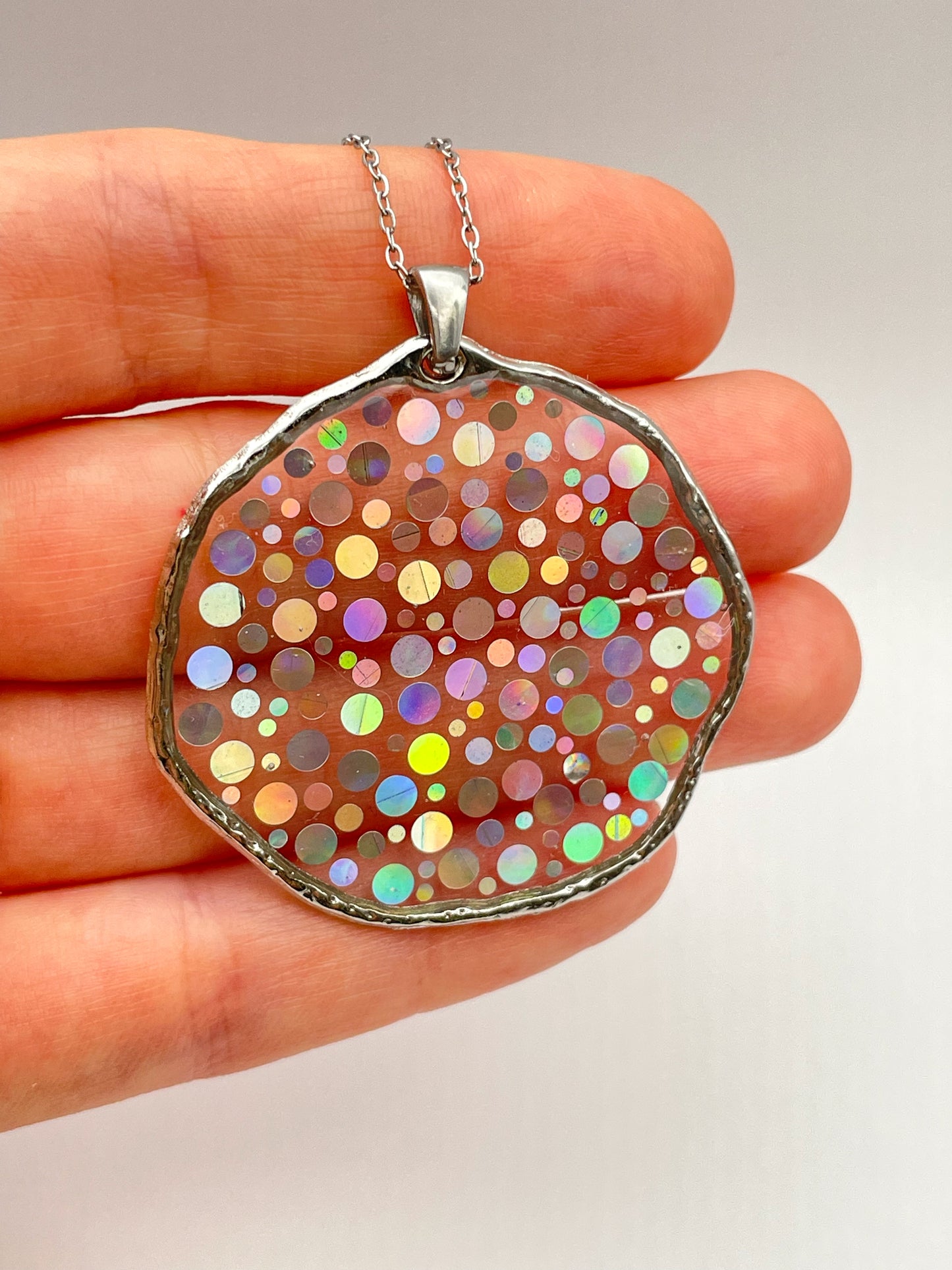 Large disco earrings with holographic silver sparkles