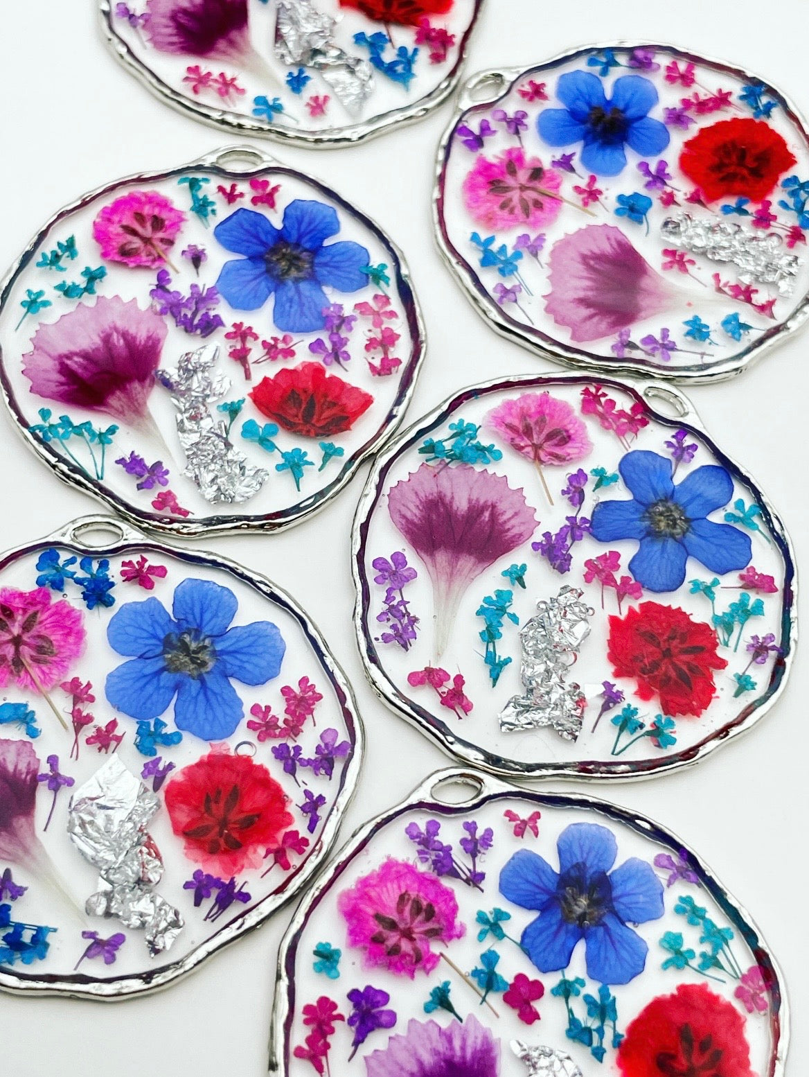 Statement earrings with colourful flowers in silver