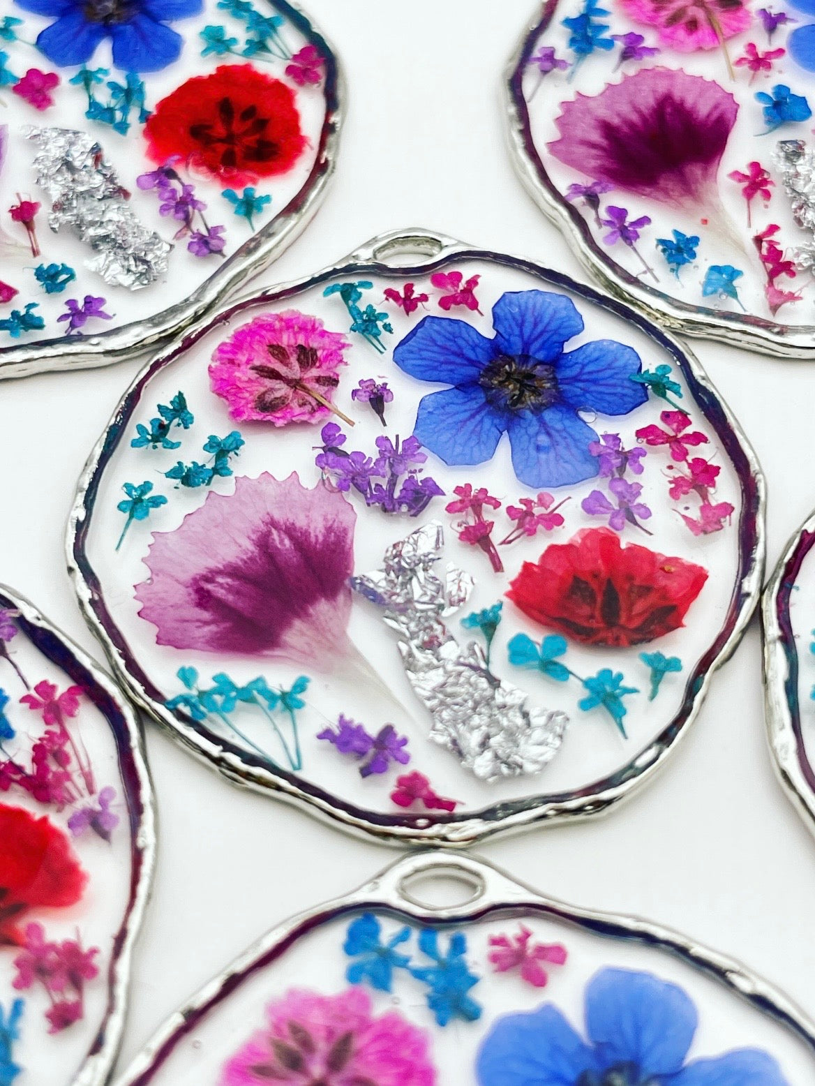 Statement earrings with colourful flowers in silver