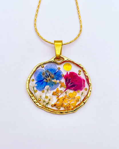 Pendant necklace with purple and blue flowers