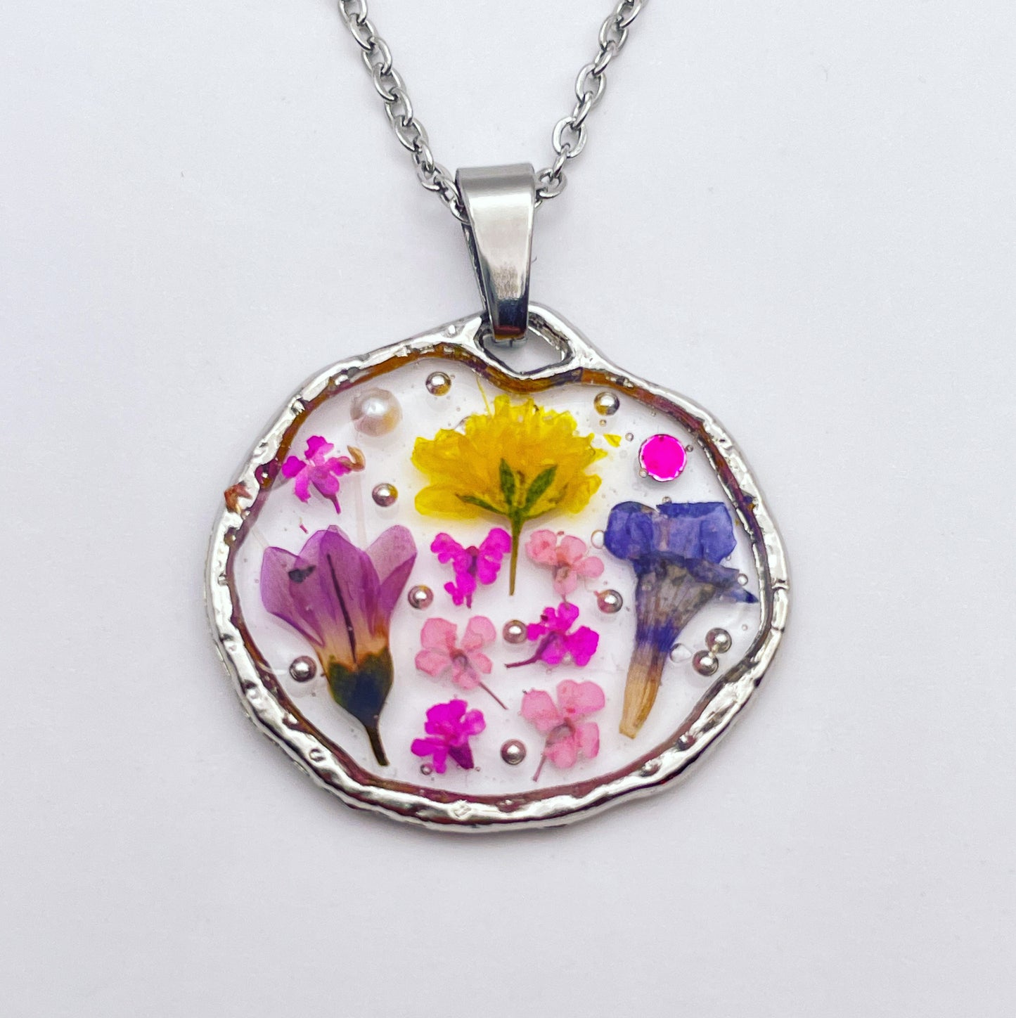 Pendant necklace with lavender and pink flowers