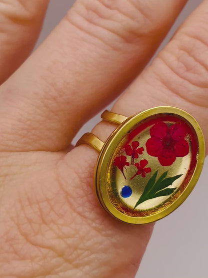 Cocktail ring with red flowers in oval shape