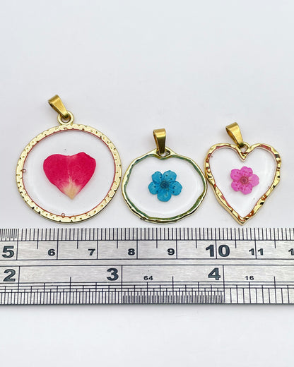 Gold dangle earrings with real pink flowers and gold leaf