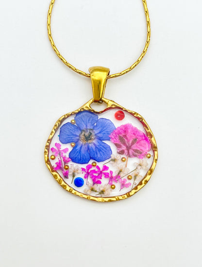 Pendant necklace with blue and pink flowers