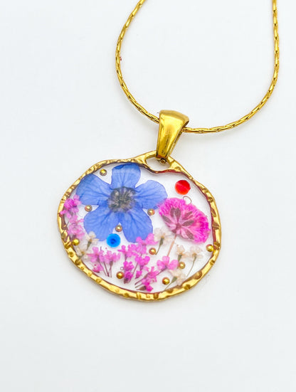 Pendant necklace with blue and pink flowers